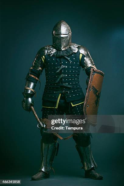 medieval knight dressed for medieval combat fight sport. - knight stock pictures, royalty-free photos & images