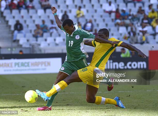 Zimbabwean player Oscar Machapa vies with Nigerian Abdullah Shehu during the 2014 African Nations Championship football match between Zimbabwe and...