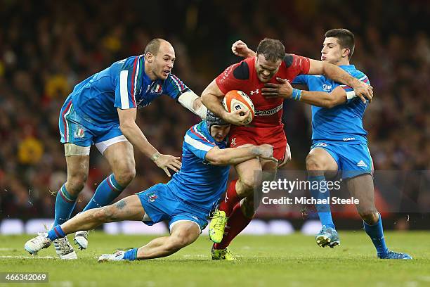 Jamie Roberts of Wales is held up by Tommaso Allan Michele Campagnaro and Sergio Parisse of Italy during the RBS Six Nations match between Wales and...