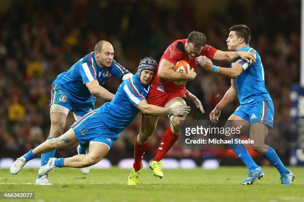 Jamie Roberts of Wales is held up by Tommaso Allan Michele Campagnaro and Sergio Parisse of Italy during the RBS Six Nations match between Wales and...