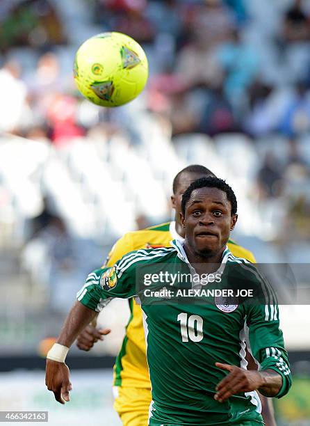 Nigerian player Dumte Christian Pyagbara runs to the ball during the 2014 African Nations Championship football match between Zimbabwe and Nigeria...