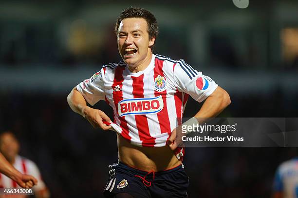 Erick Torres of Chivas celebrate after scoring the second goal of his team during a match between Puebla and Chivas as part of 10th round Clausura...