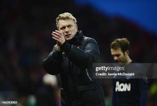 David Moyes, manager of Manchester United walks off with Juan Mata after the Barclays Premier League match between Stoke City and Manchester United...