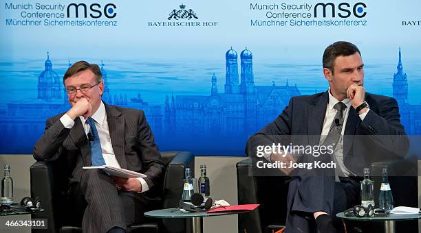 Leonid Kozhara, Ukrainian Minister for Foreign Affairs and head of the Ukrainian UDAR party Vitali Klitschko sit next to each other during a panel...