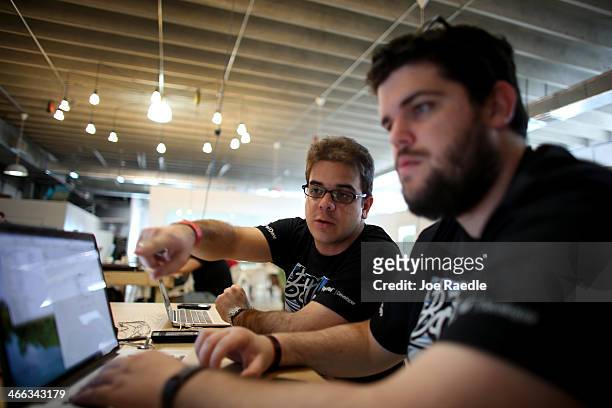 Osniel Gonzalez and Jose Pimienta work on a project they are calling Cuba Direct during the Hackathon for Cuba event on February 1, 2014 in Miami,...