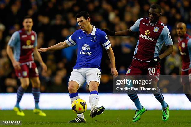 Gareth Barry of Everton in action with Christian Benteke of Aston Villa during the Barclays Premier League match between Everton and Aston Villa at...