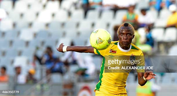 Zimbabwean player Kudakwashe Mahachi attempts to score a goal against Nigeria during the 2014 African Nations Championship football match between...