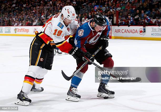 Tyson Barrie of the Colorado Avalanche controls the puck against David Jones of the Calgary Flames at Pepsi Center on March 14, 2015 in Denver,...
