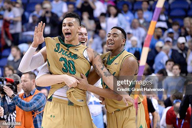 Zach Auguste, Bonzie Colson and the Notre Dame Fighting Irish celebrate after defeating the North Carolina Tar Heels during the championship game of...