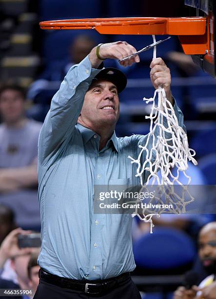 Head coach Mike Brey of the Notre Dame Fighting Irish celebrates after defeating the North Carolina Tar Heels 90-82 to win the 2015 ACC Basketball...