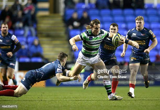 Andrew Fenby of London Irish is tackled during the LV= Cup Match between London Irish and Scarlets at the Madejski Stadium on February 1, 2014 in...