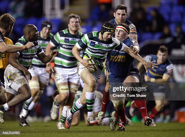 Miles Dorrian of London Irish is tackled during the LV= Cup Match between London Irish and Scarlets at the Madejski Stadium on February 1, 2014 in...