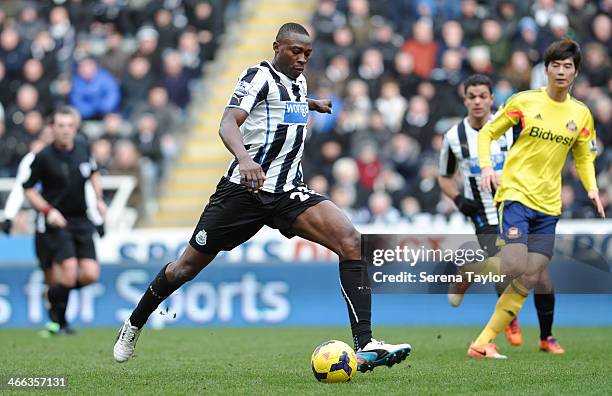 Shola Ameobi of Newcastle strikes the ball during the Barclays Premier League match between Newcastle United and Sunderland at St. James' Park on...