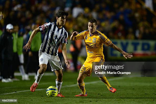 Jesus Duenas of Tigres figths for the ball with Erick Gutierrez of Pachuca during a match between Tigres UANL and Pachuca as part of 10th round...