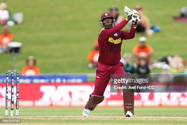 Johnson Charles plays a shot during the 2015 ICC Cricket World Cup match between the West Indies and United Arab Emirates at McLean Park on March 15,...