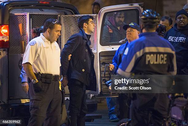 St. Louis Police arrest photojournalist Philip Montgomery at a protest staged by Ferguson activists on March 14, 2015 in St. Louis, Missouri. St....