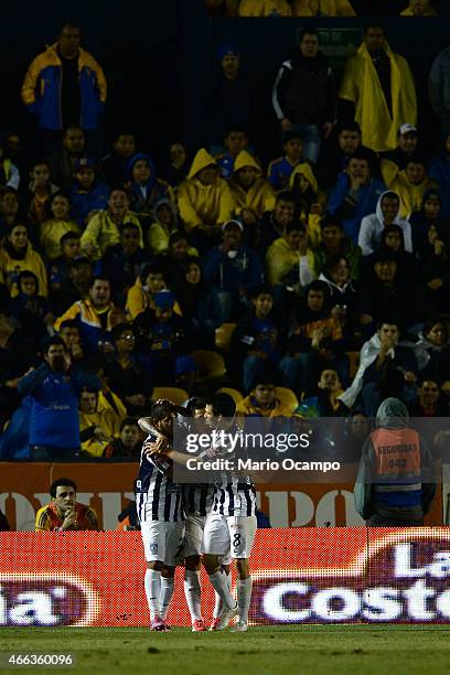 Players of Pachuca celebrate after German Cano scored his team's first goal during a match between Tigres UANL and Pachuca as part of 10th round...