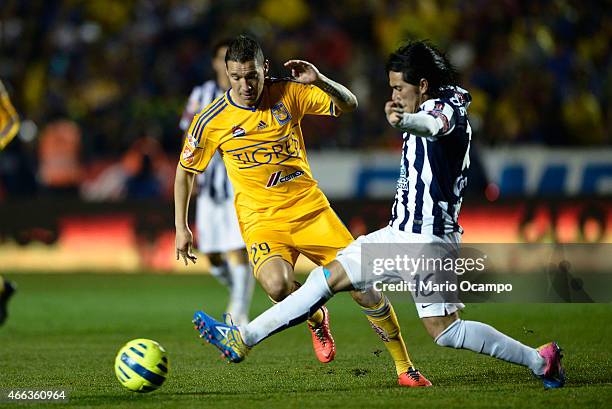 Jesus Duenas of Tigres figths for the ball with Jorge Hernandez of Pachuca during a match between Tigres UANL and Pachuca as part of 10th round...