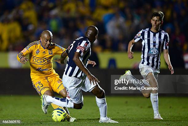 Egidio 'Cacha' Arevalo of Tigres fights for the ball with Aquivaldo Mosquera of Pachuca during a match between Tigres UANL and Pachuca as part of...