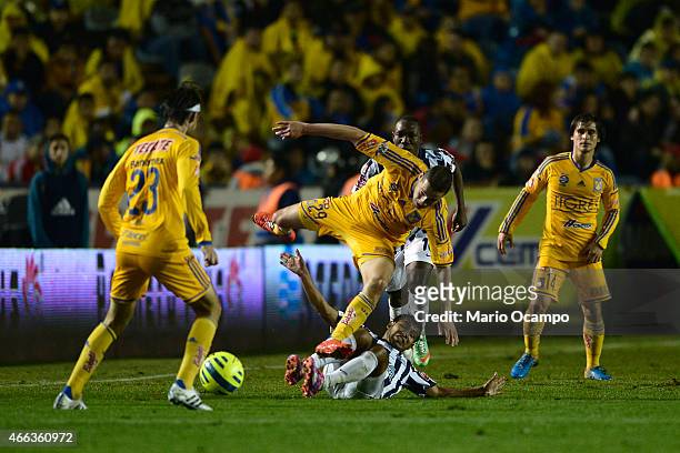 Jesus Duenas of Tigres falls during a match between Tigres UANL and Pachuca as part of 10th round Clausura 2015 Liga MX at Universitario Stadium on...