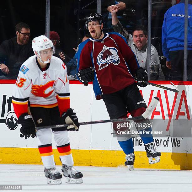 John Mitchell of the Colorado Avalanche celebrates his goal as Johnny Gaudreau of the Calgary Flames skates away to give the Avs a 3-1 lead in the...