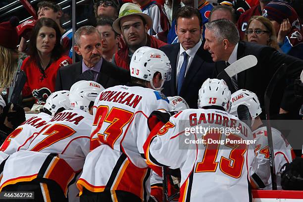 Assistant coach Jacques Cloutier, assistant coach Martin Gelinas and head coach Bob Hartley direct the team during a timeout against the Colorado...