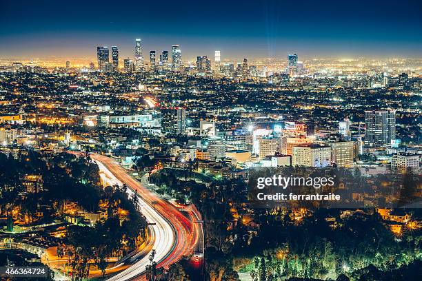 los angeles skyline at night - hollywood boulevard stock pictures, royalty-free photos & images