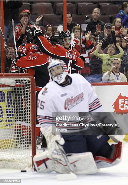 Travis Konecny, Jonathan Duchesne, Jacob Middleton and Ryan Van Stralen of the Ottawa 67's celebrate their first period goal as Ken Appleby of the...