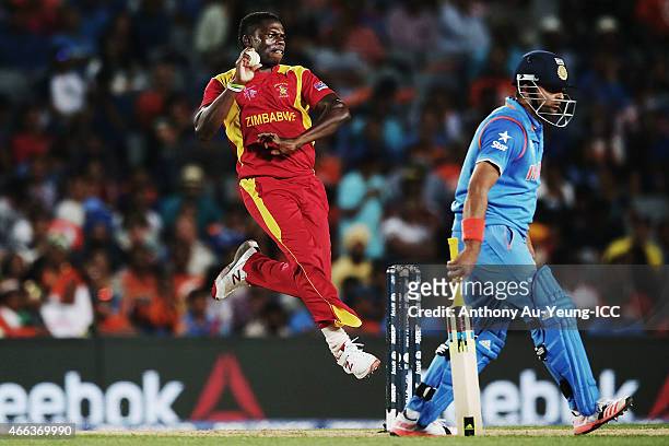 Tawanda Mupariwa of Zimbabwe bowls during the 2015 ICC Cricket World Cup match between India and Zimbabwe at Eden Park on March 14, 2015 in Auckland,...