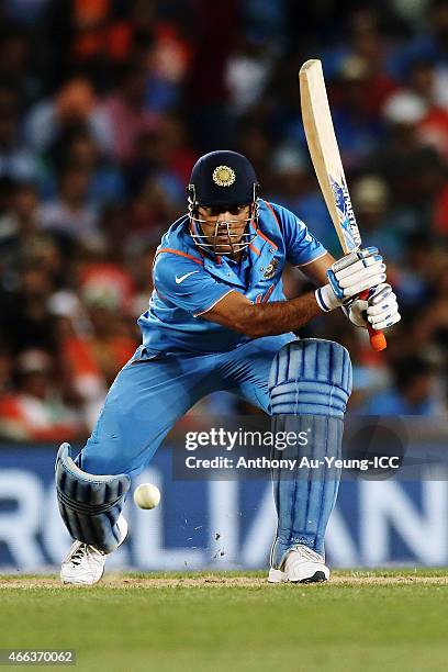 Dhoni of India bats during the 2015 ICC Cricket World Cup match between India and Zimbabwe at Eden Park on March 14, 2015 in Auckland, New Zealand.