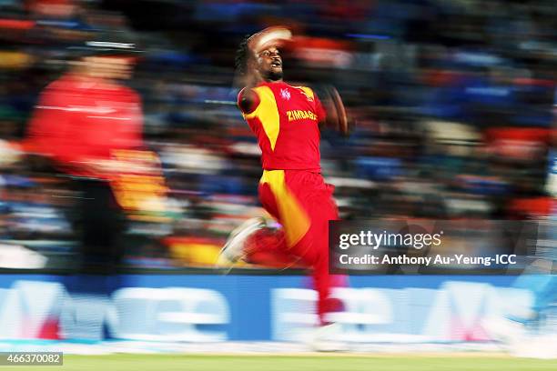 Solomon Mire of Zimbabwe bowls during the 2015 ICC Cricket World Cup match between India and Zimbabwe at Eden Park on March 14, 2015 in Auckland, New...