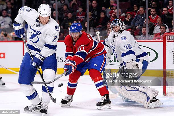 Eric Brewer of the Tampa Bay Lightning stops Max Pacioretty of the Montreal Canadiens from deflecting the puck in front of Ben Bishop of the Tampa...