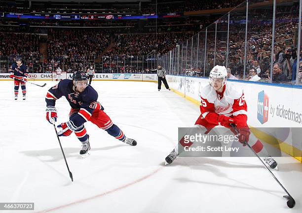 Cory Emmerton of the Detroit Red Wings skates with the puck against the New York Rangers at Madison Square Garden on January 16, 2014 in New York...
