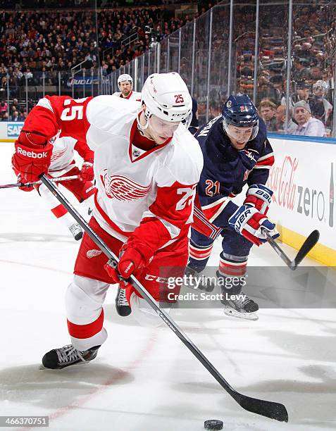 Cory Emmerton of the Detroit Red Wings skates with the puck against the New York Rangers at Madison Square Garden on January 16, 2014 in New York...