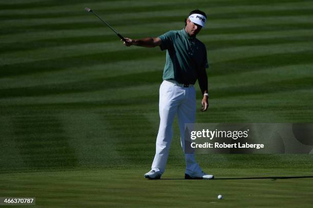 Bubba Watson celebrates a birdie on the 8th hole during the third round of the Waste Management Phoenix Open at TPC Scottsdale on February 1, 2014 in...