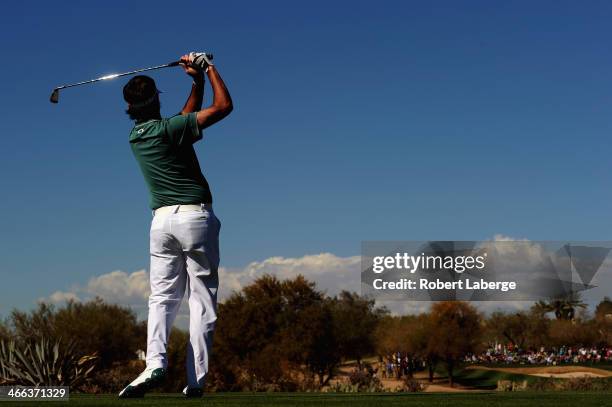 Bubba Watson plays a shot on the 17th hole during the third round of the Waste Management Phoenix Open at TPC Scottsdale on February 1, 2014 in...