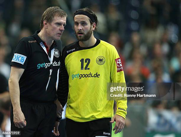 Headcoach Martin Heuberger of Germany chats with goalkeeper Silvio Heinevetter of Germany during the All Star Game 2014 between Germany and the...