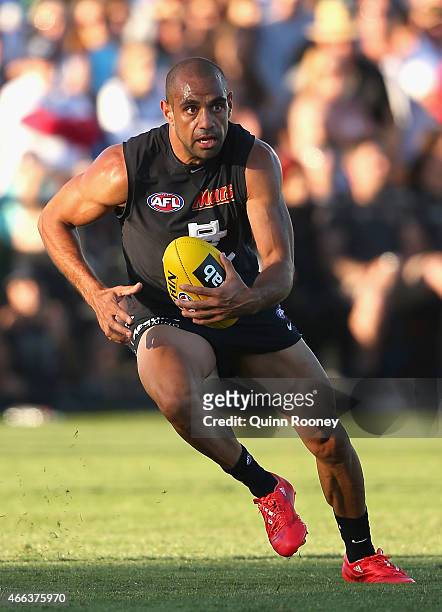 Chris Yarran of the Blues gathers the ball during the NAB Challenge AFL match between the Collingwood Magpies and the Carlton Blues at Queen...