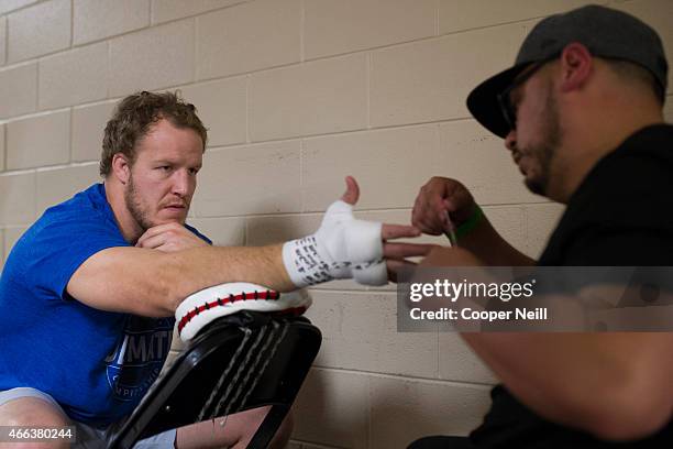 Jared Rosholt has his hands wrapped back stage before fighting Josh Copeland during UFC 185 at the American Airlines Center on March 14, 2015 in...