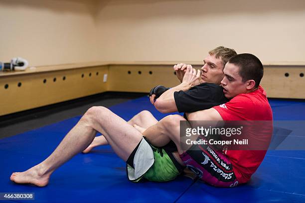 Ryan Benoit warms up backstage before fighting Sergio Pettis during UFC 185 at the American Airlines Center on March 14, 2015 in Dallas, Texas.