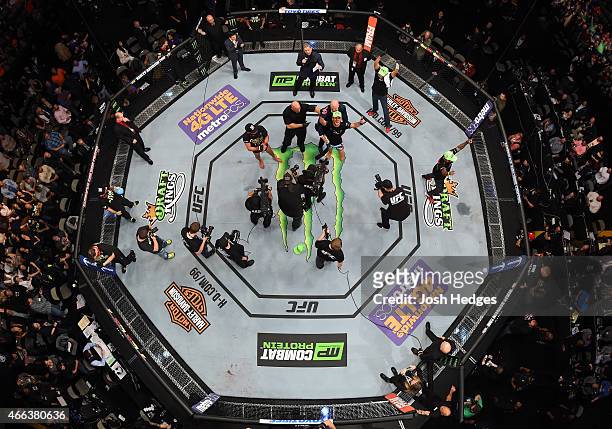 An overhead view of the Octagon as Rafael dos Anjos reacts after dominating Anthony Pettis to win the UFC lightweight championship during the UFC 185...