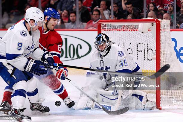 Ben Bishop of the Tampa Bay Lightning gets down to stop the puck on an attempt by Max Pacioretty of the Montreal Canadiens during the NHL game at the...
