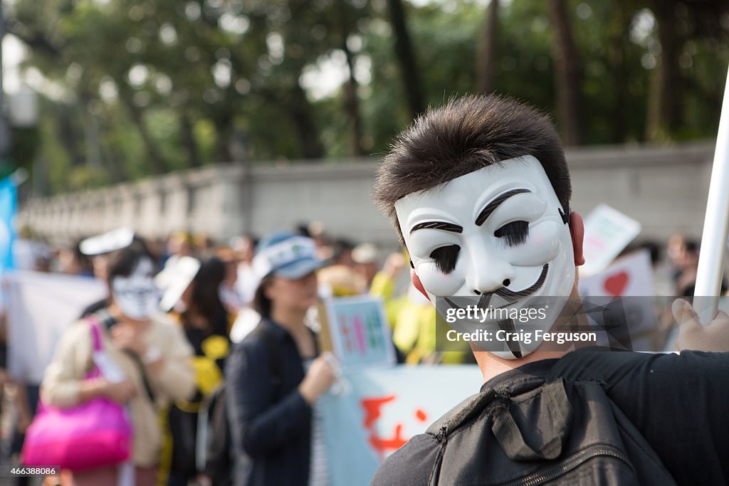 The obligatory mask makes an appearance at an anti-nuclear...