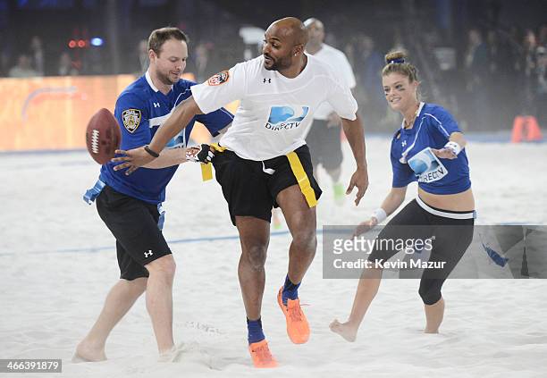 Host Ryen Rusillo, former NFL player Amani Toomer and model Nina Agdal participate in the DirecTV Beach Bowl at Pier 40 on February 1, 2014 in New...
