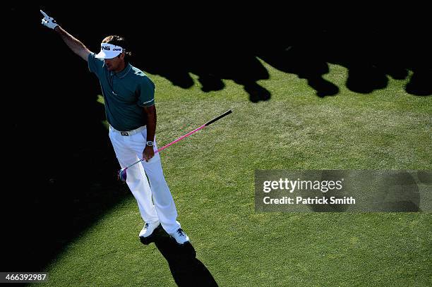 Bubba Watson reacts as he plays a tee shot on the 17th hole during the third round of the Waste Management Phoenix Open at TPC Scottsdale on February...