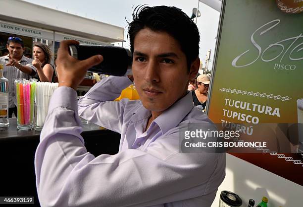 Bartender prepares Pisco Sour at a stand in a street festival in Lima on February 1 during celebrations for the national Day of Pisco Sour, an...