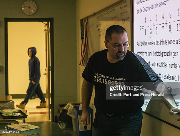 Biddeford High School math teacher Jon Jacques instructs his calculous class on a lesson related to the pi figure at Biddeford High School in...