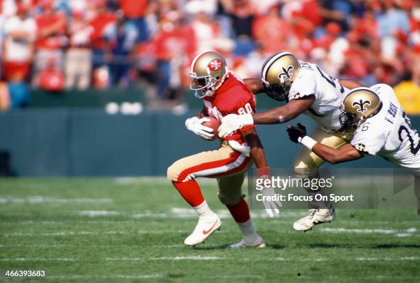 Wide Receiver Jerry Rice of the San Francisco 49ers in action against the New Orleans Saints during an NFL football game circa 1990 at Candlestick...