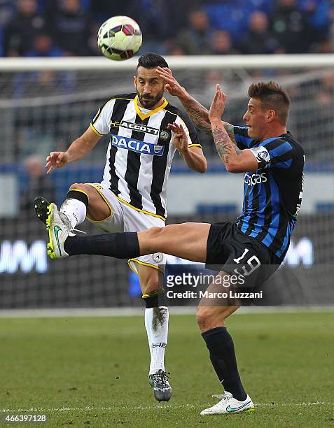Giampiero Pinzi of Udinese Calcio is challenged by German Gustavo Denis of Atalanta BC during the Serie A match between Atalanta BC and Udinese...