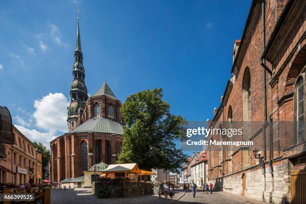 the apse and the bell-tower of st. peter church - riga stock pictures, royalty-free photos & images